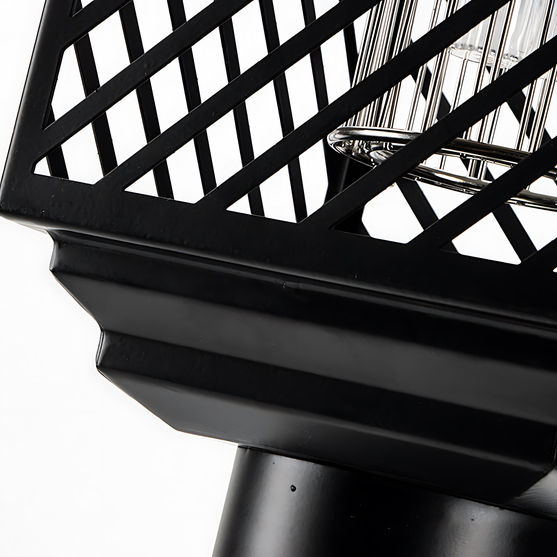 Detailed view of black mesh pattern and structural components of solar light design