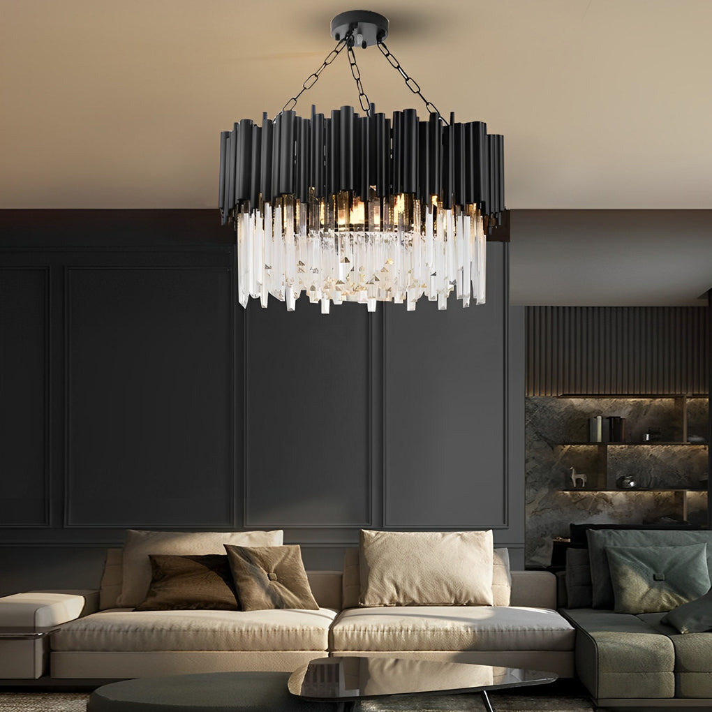 Black metal and crystal chandelier with a modern design, hanging above a dining table.