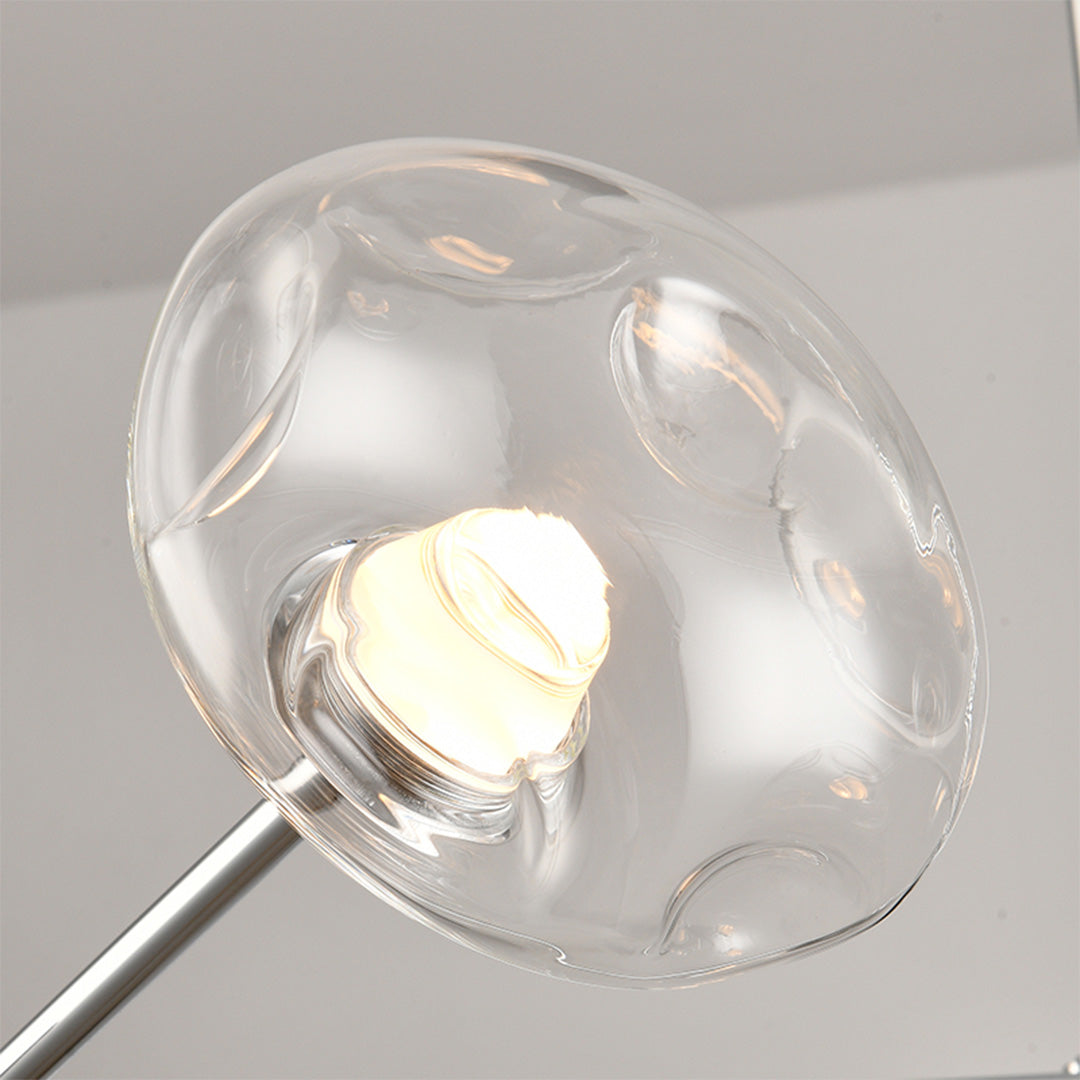 Central hub detail of LED chandelier lights featuring black metal construction with extending arms design