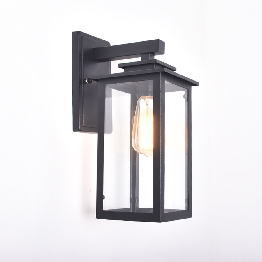 Black metal outdoor wall lantern with clear glass panels and Edison bulb for exterior lighting