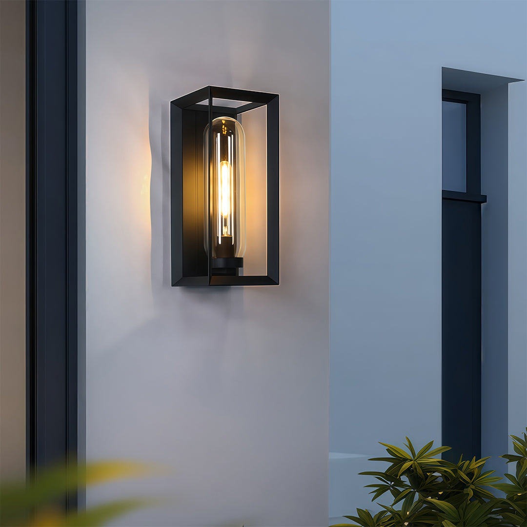 Black outdoor wall sconce modern fixture mounted on minimalist white facade with geometric design