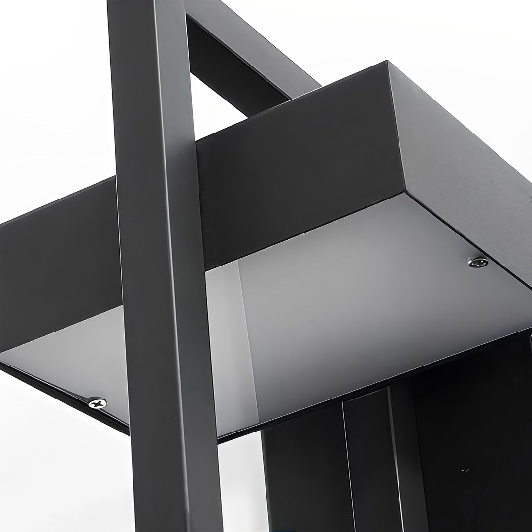 Close up view of metal housing edge on an black outdoor wall sconce modern.