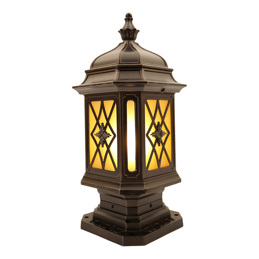 Black outside pillar light with diamond pattern glass and traditional lantern design for garden and pathway illumination