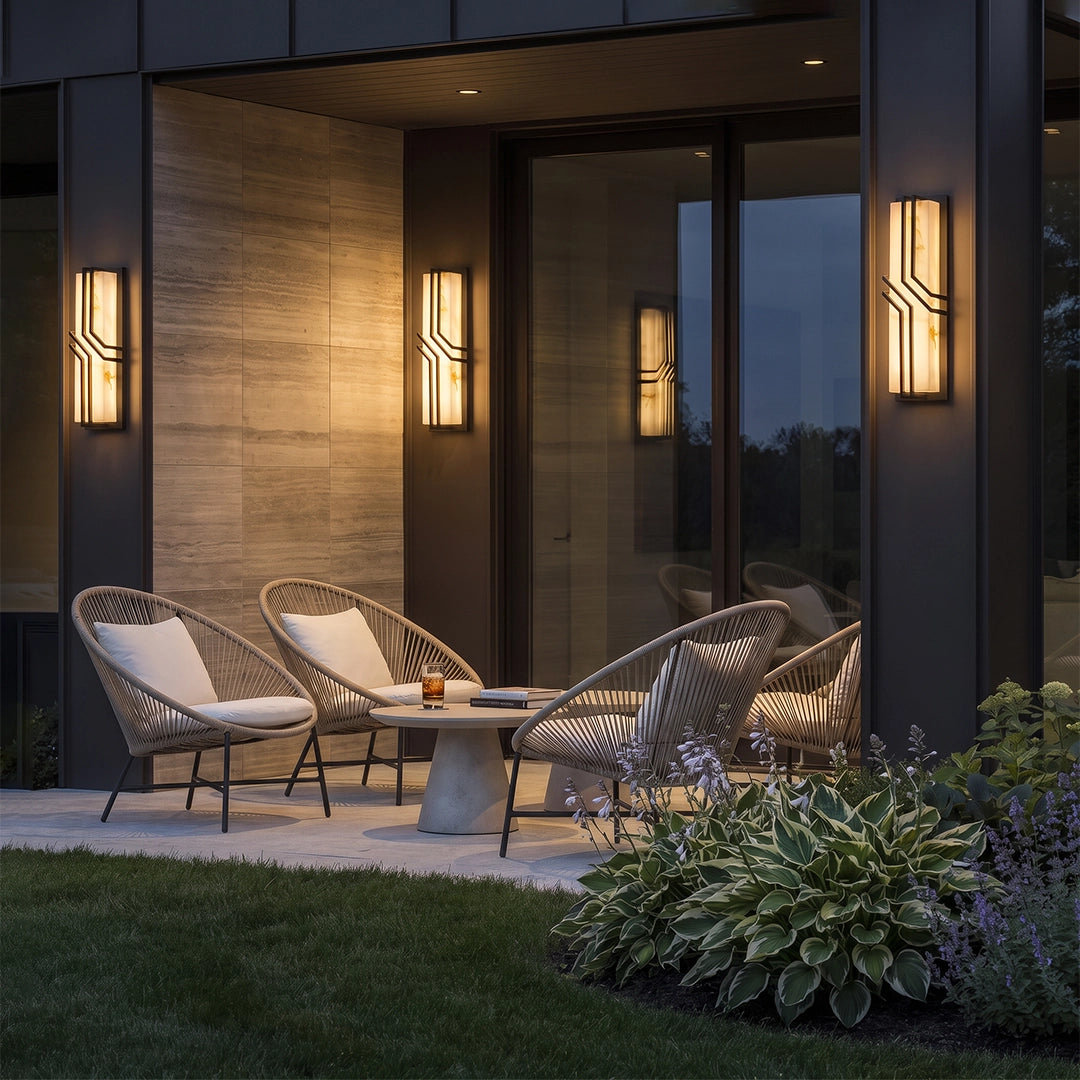 Black outside wall lights with an elongated frame and textured glass for modern exterior spaces.