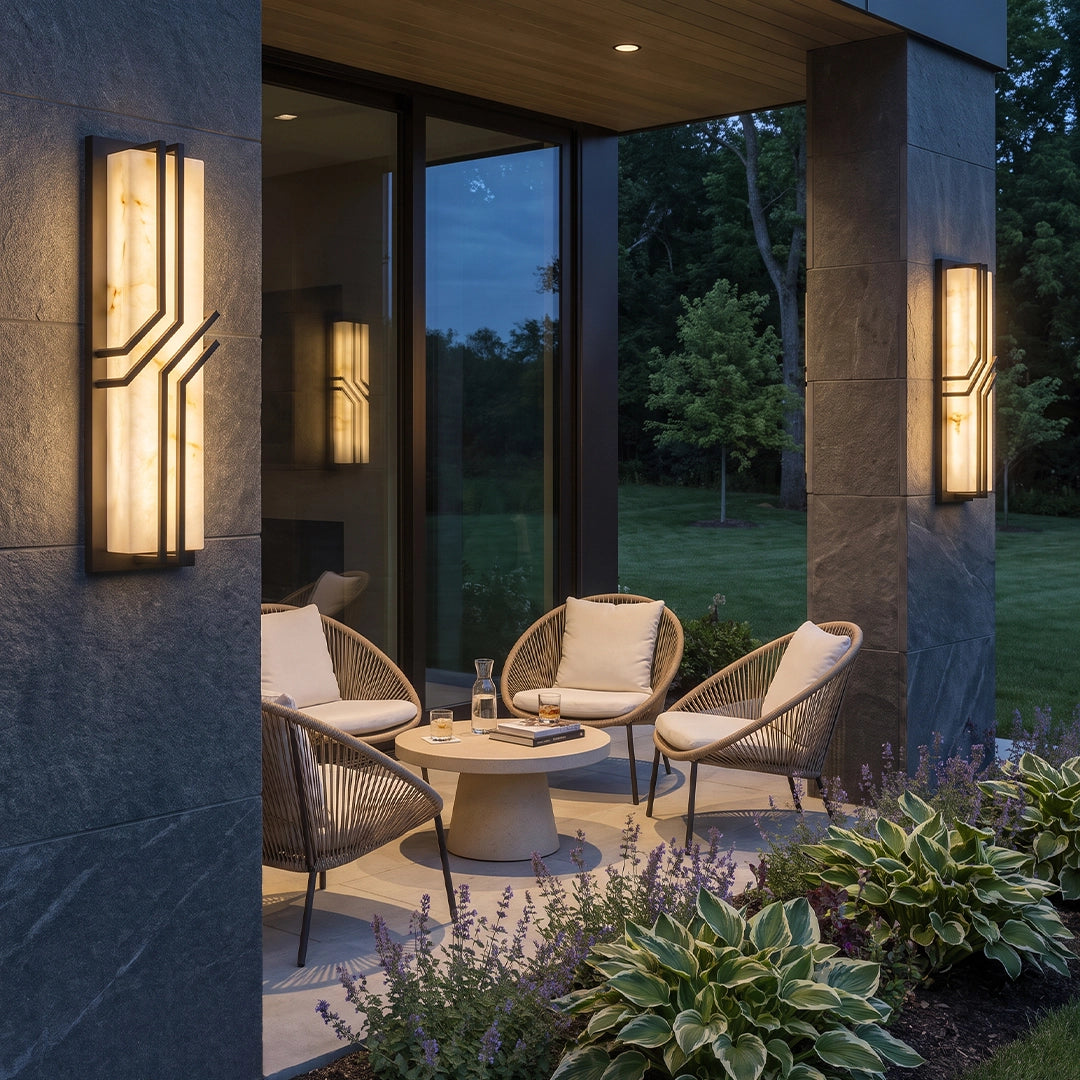 Black outside wall lights mounted on both sides of a wooden front door for balanced entry lighting.