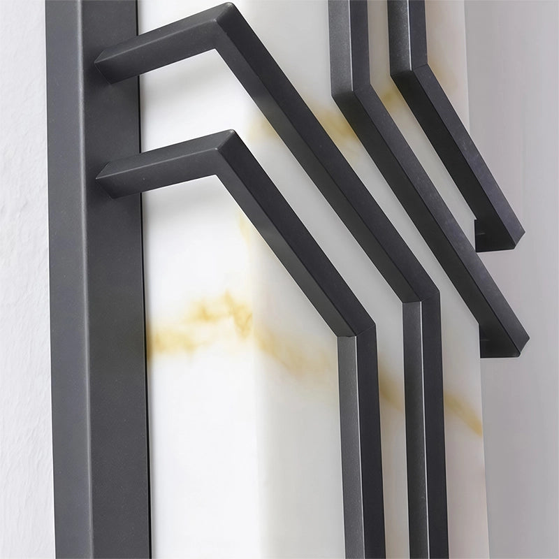 Black outside wall lights flanking a modern garden gate for welcoming nighttime illumination.