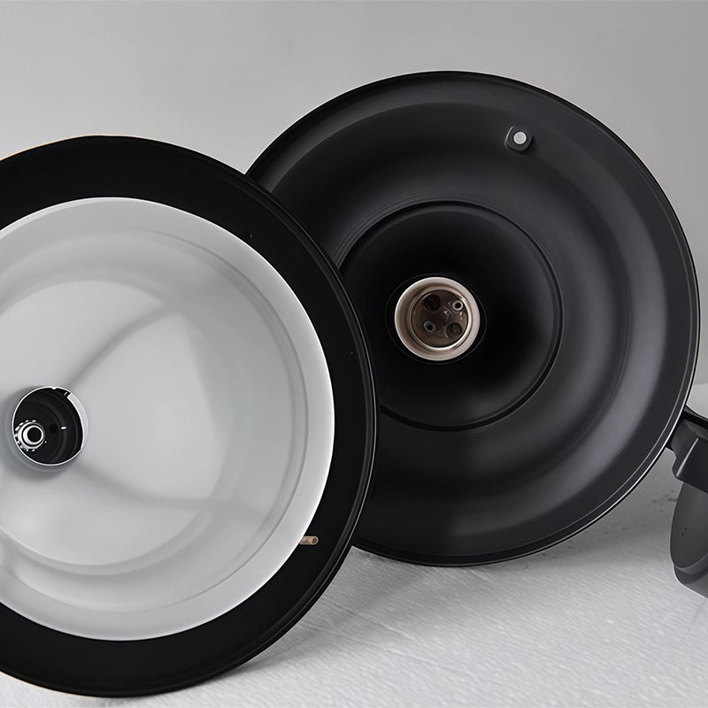 Black outside wall lights close-up highlighting the round mounting plate and fixture connection.
