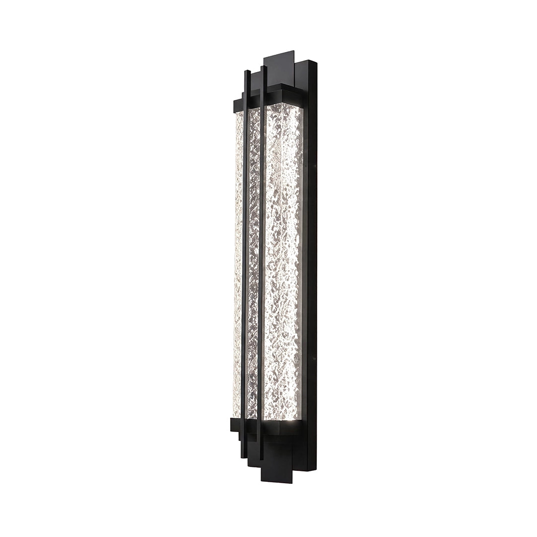 Black outside wall lights with a narrow vertical profile and clear textured glass construction.
