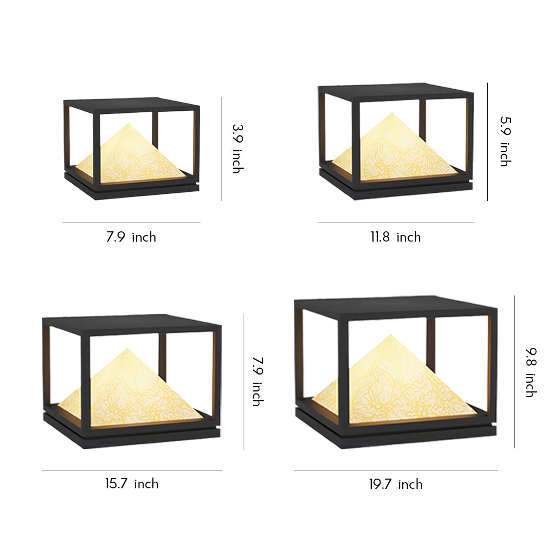 Modern black-frame pyramid light pillar design with warm glow for contemporary outdoor settings.