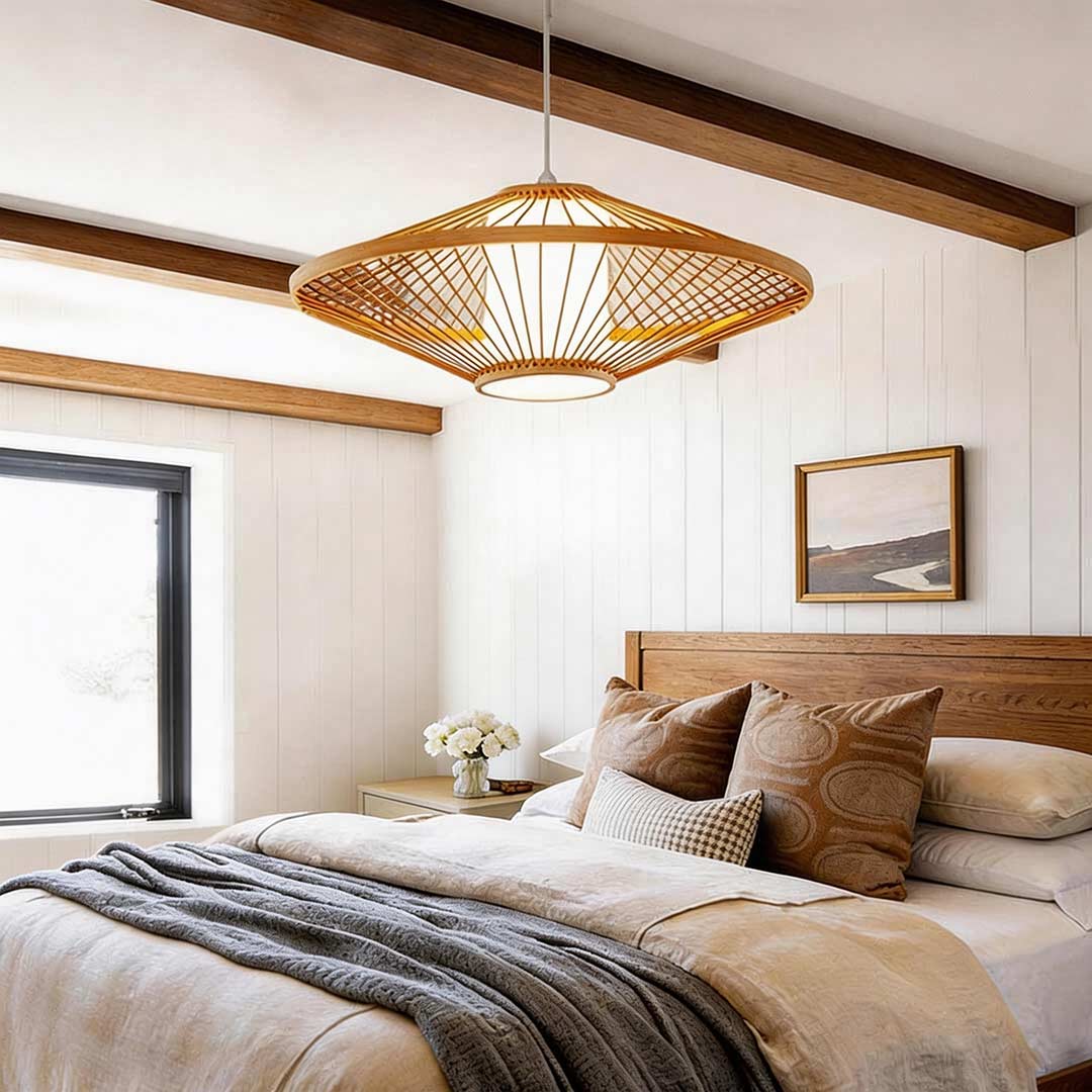 Black rattan pendant light with a sleek design, enhancing a modern dining room.