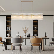 Modern black rectangular glass lamp shade chandelier above a minimalist dining setup for stylish homes.