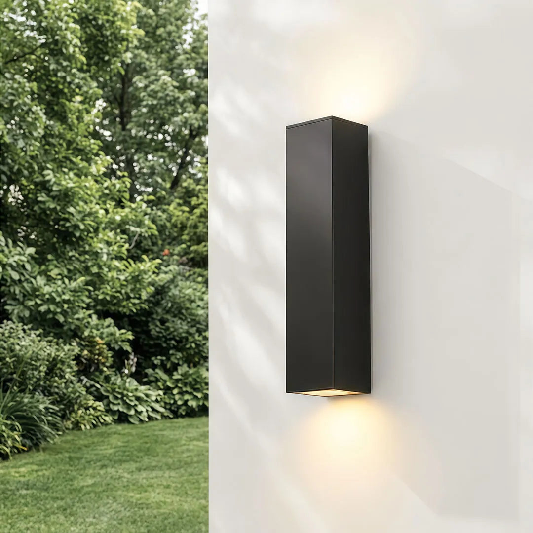 Black rectangular outdoor up down wall light with warm illumination
