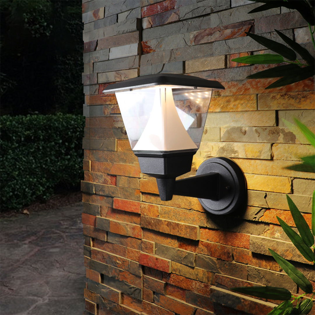 Elegant residential entrance featuring warm outdoor lighting and Mediterranean-style architectural details