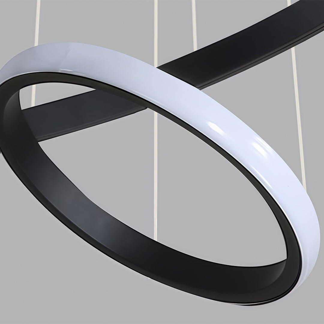 Black ring LED chandelier with sculptural hanging form.