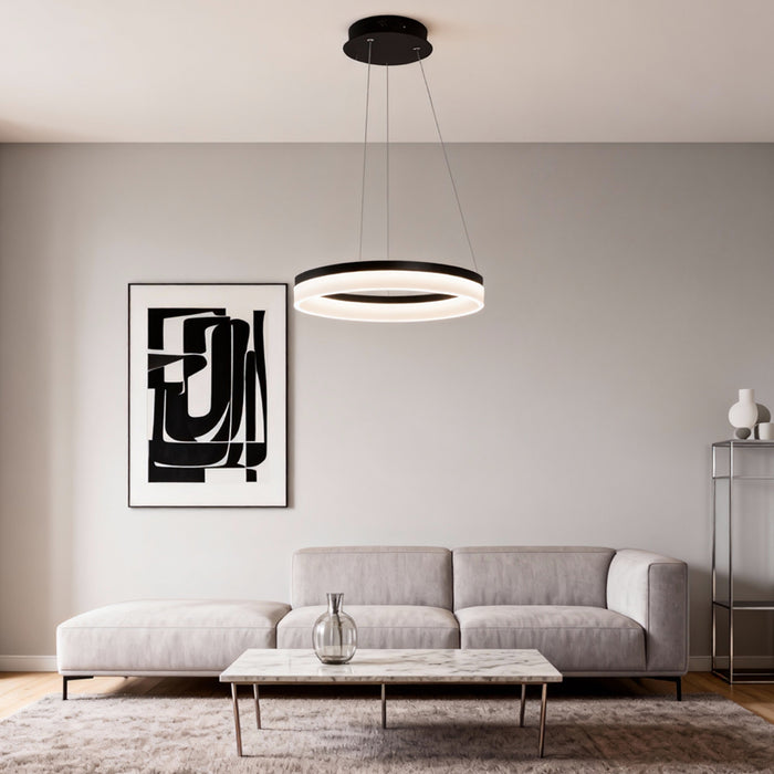 Modern black ring pendant light installed above a minimalist living room sofa with soft ambient lighting.