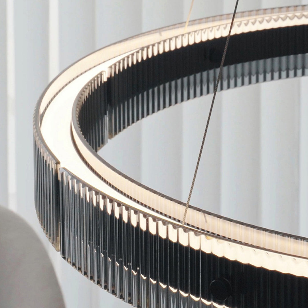 Close-up detail of black round pendant light showcasing curved LED strip and premium construction