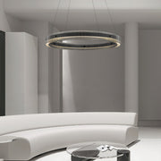 Black round pendant light providing sophisticated ambient lighting in contemporary living room