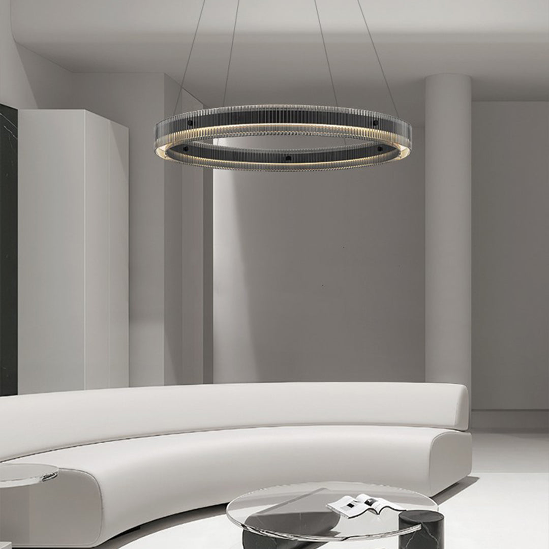 Black round pendant light providing sophisticated ambient lighting in contemporary living room