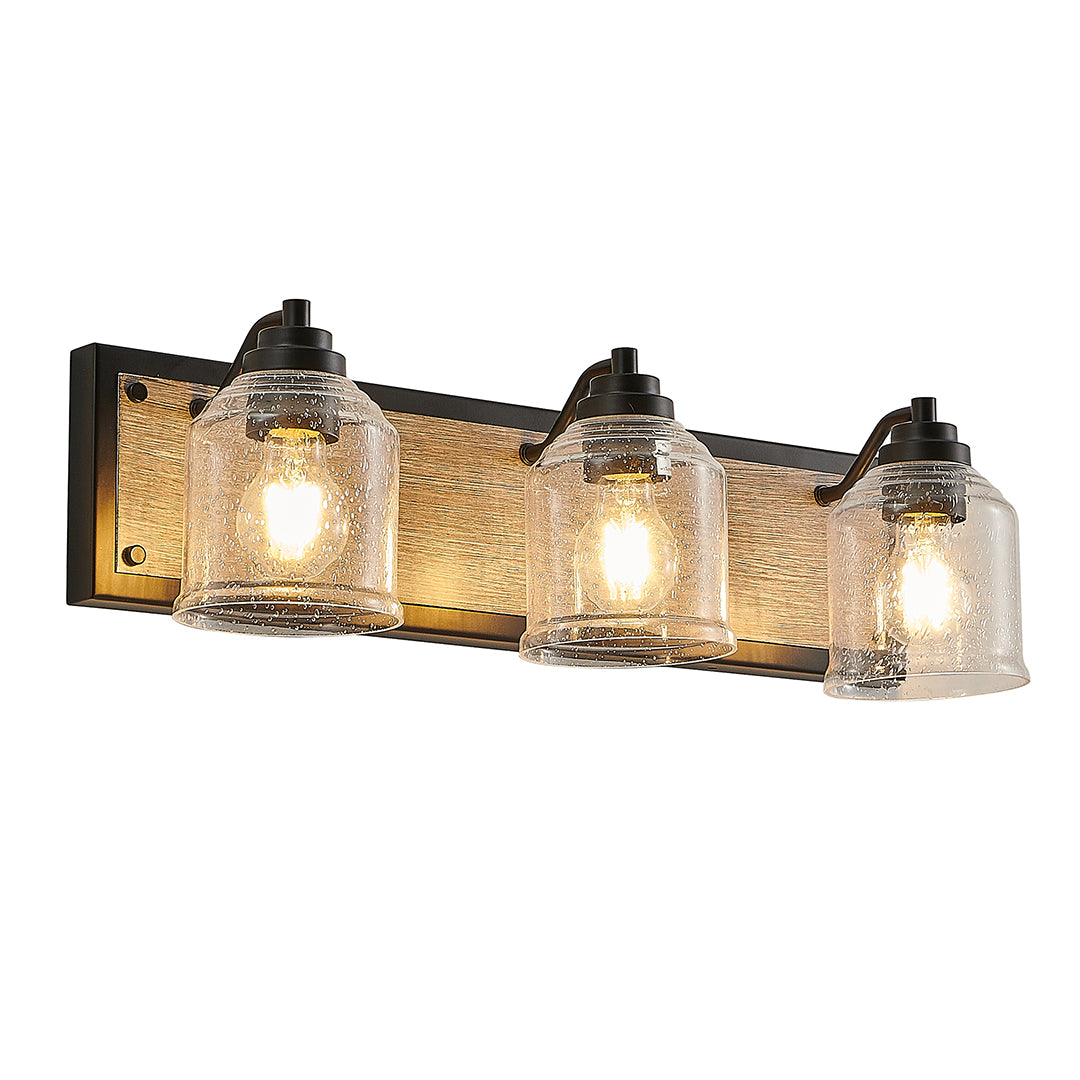 Black multi-light wall sconce with rustic glass shades, perfect for farmhouse or industrial-style bathroom lighting.