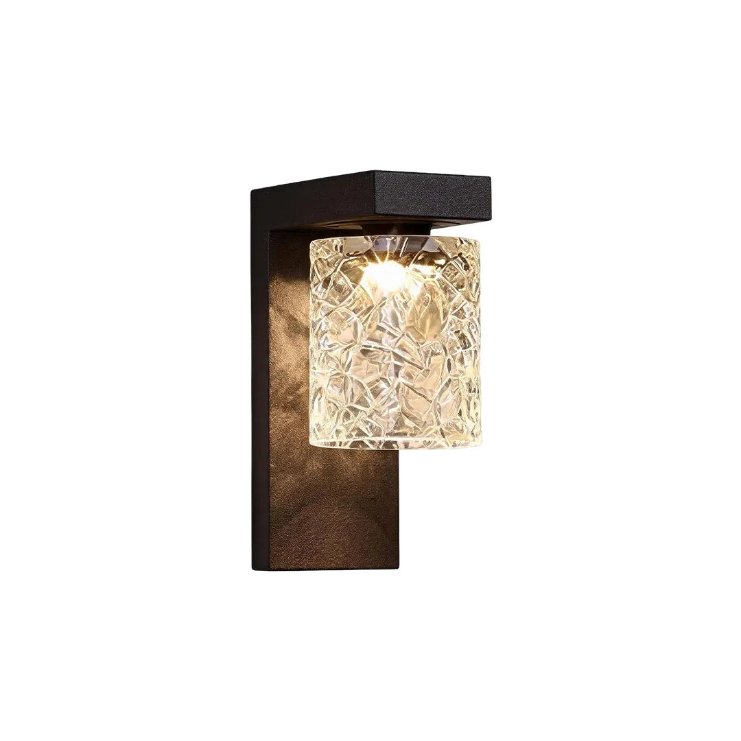 Black sconce wall light in a slim vertical design with a textured glass shade and dark metal frame.