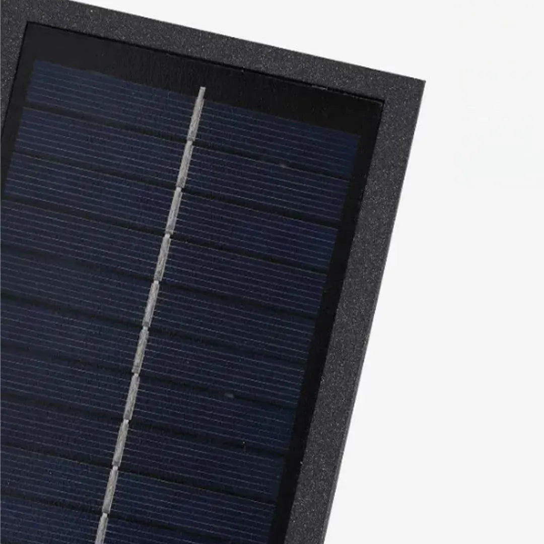 Solar panel detail view of a black sconce wall light for outdoor use.