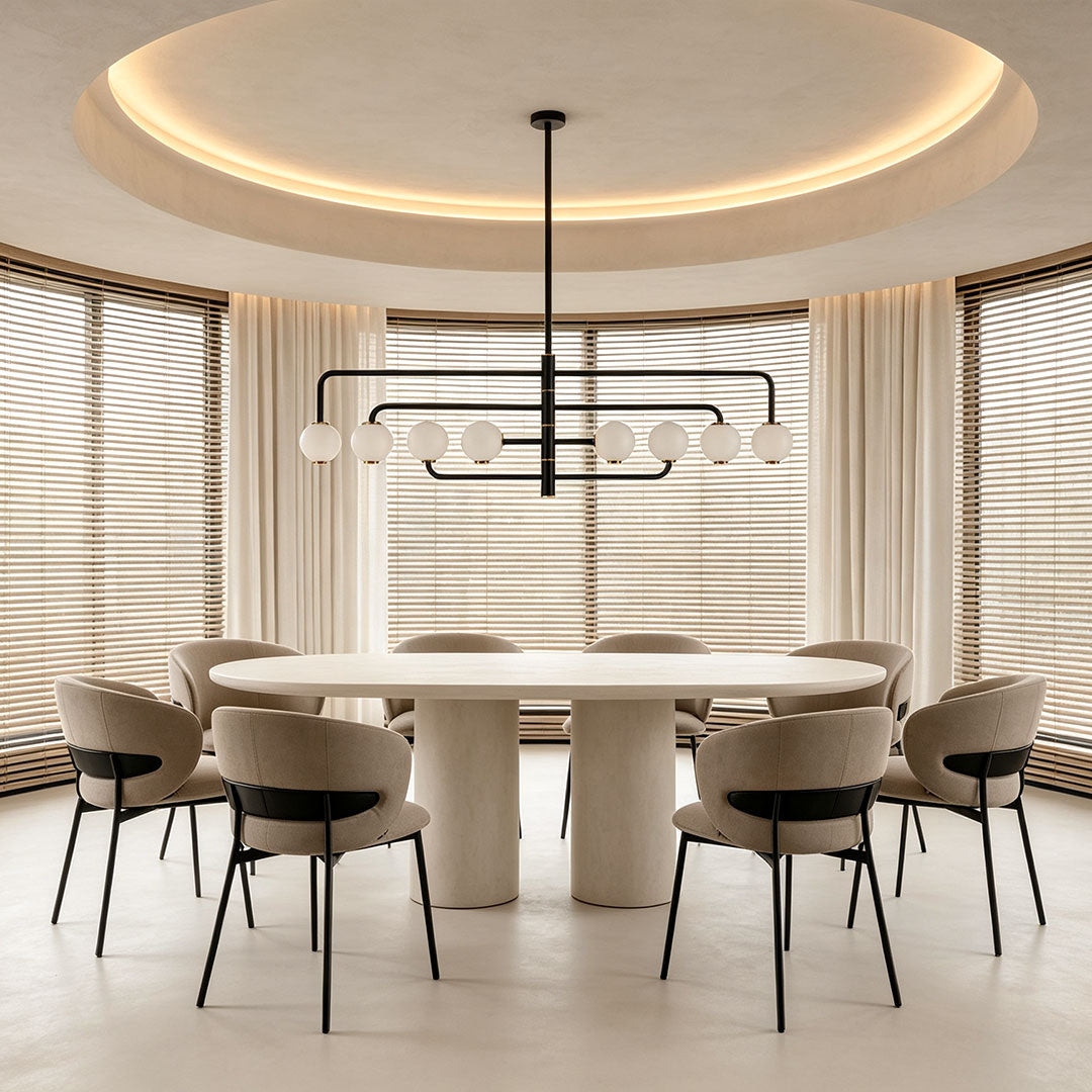 Black semi flush mount light centered above a round dining table in a bright dining room with curved ceiling detail.