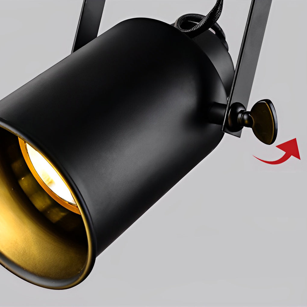 Close-up of a black track light fixture with a gold interior, showcasing its design.
