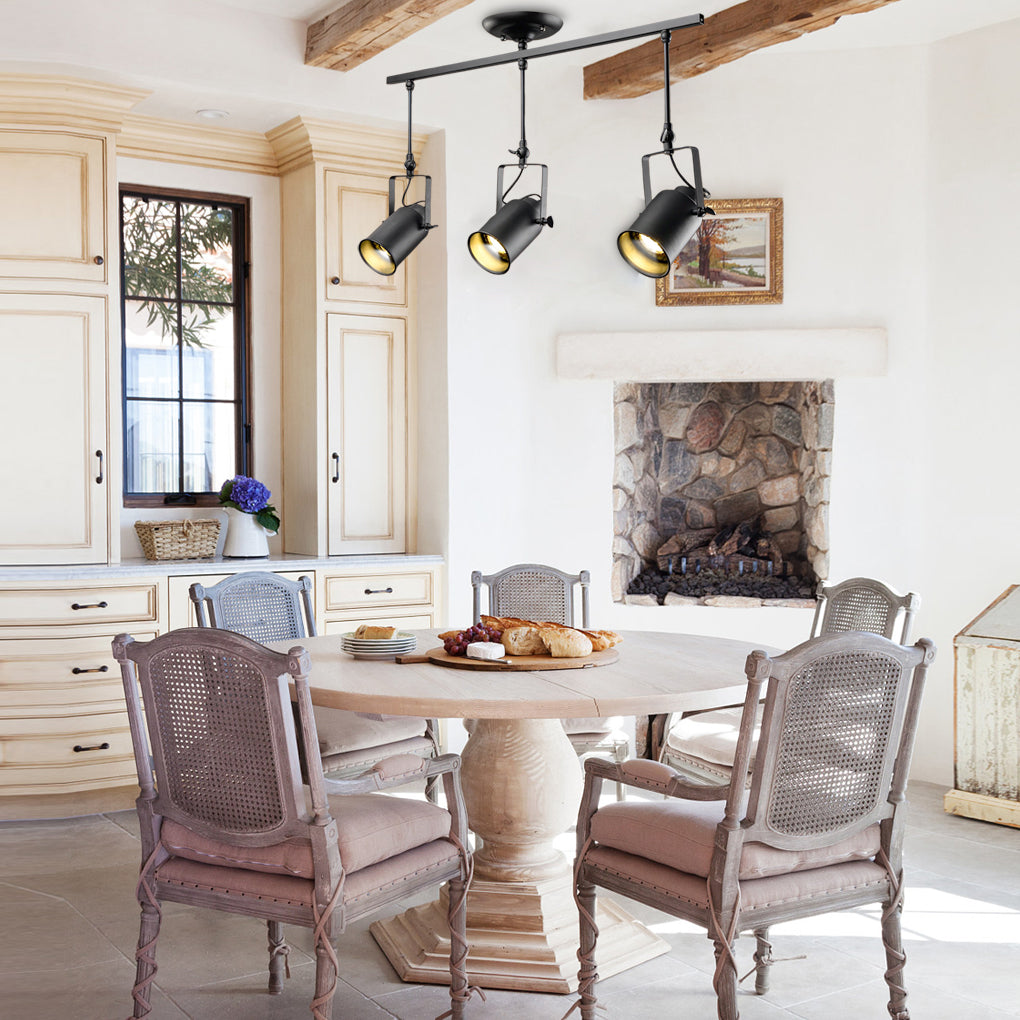 Black track light enhancing the ambiance of a rustic dining room with wooden furniture.