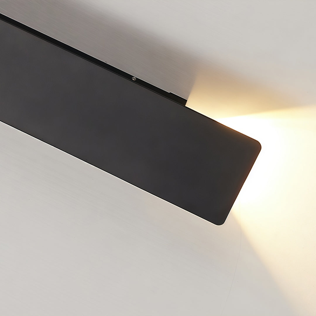 Detailed side view of black up and down wall lights with slim rectangular housing design.