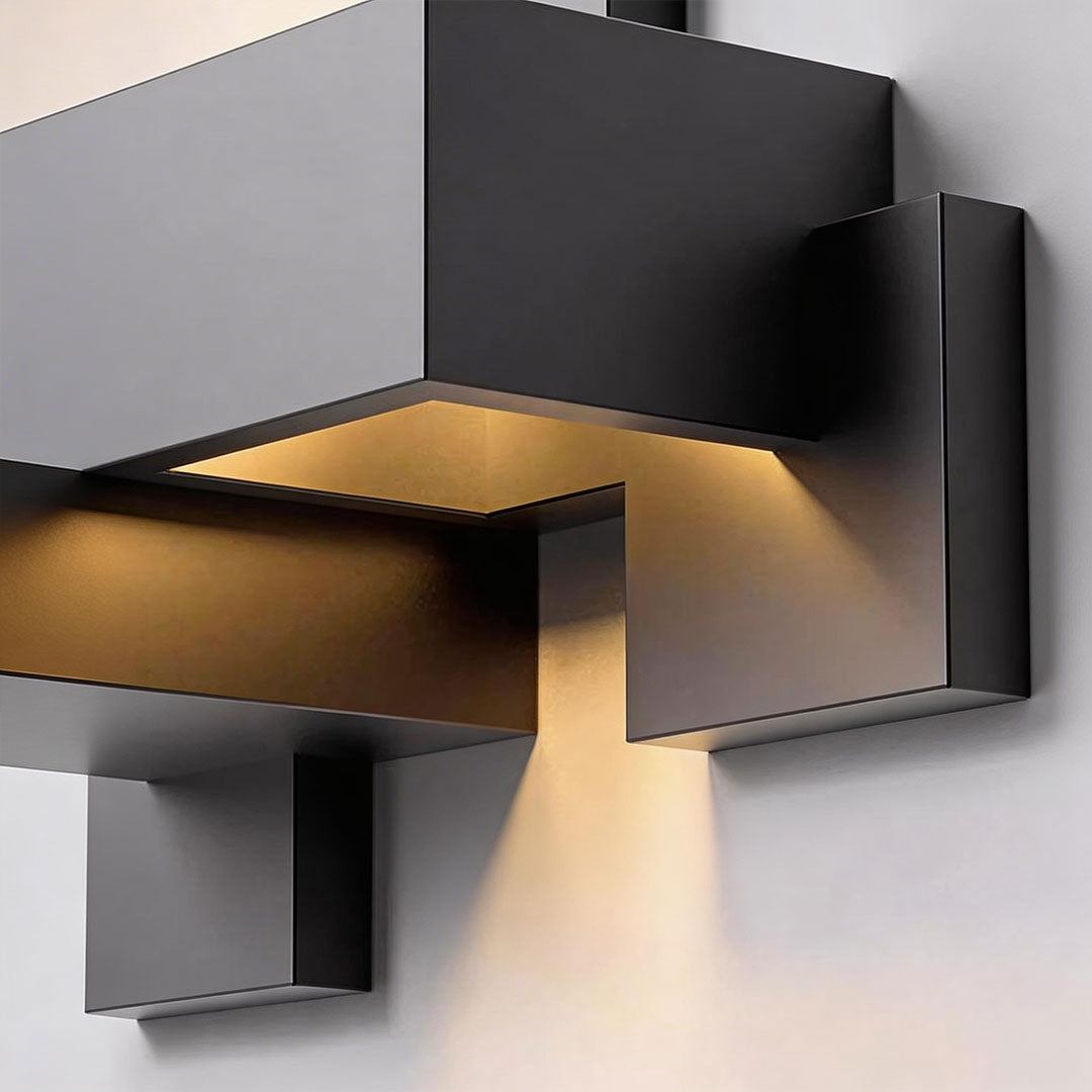 Black up down wall lights with a modern design, providing soft illumination.