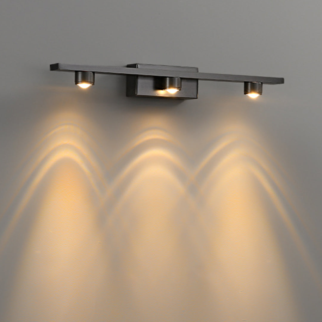 Black vanity lights for bathroom creating ambient wall lighting with multiple warm spotlights