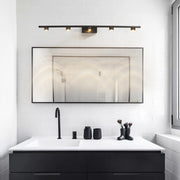 Black vanity lights for bathroom installed above contemporary mirror in luxury modern bathroom setting