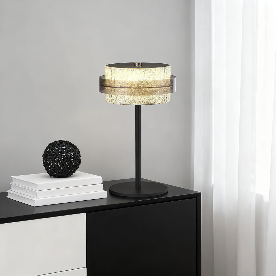 Black vintage metal table lamp style with a textured crystal ring, used on a modern two-tone nightstand.