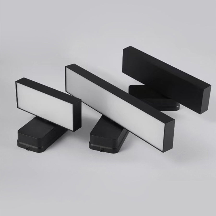 Sleek black wall fixtures with multiple mounting configurations for versatile installation
