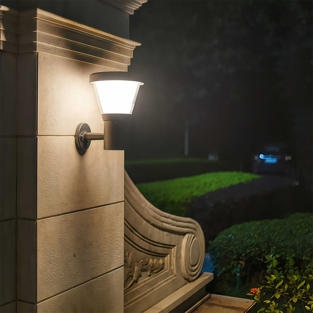 Black outdoor wall light installed on a modern building, offering clean illumination for the front area.