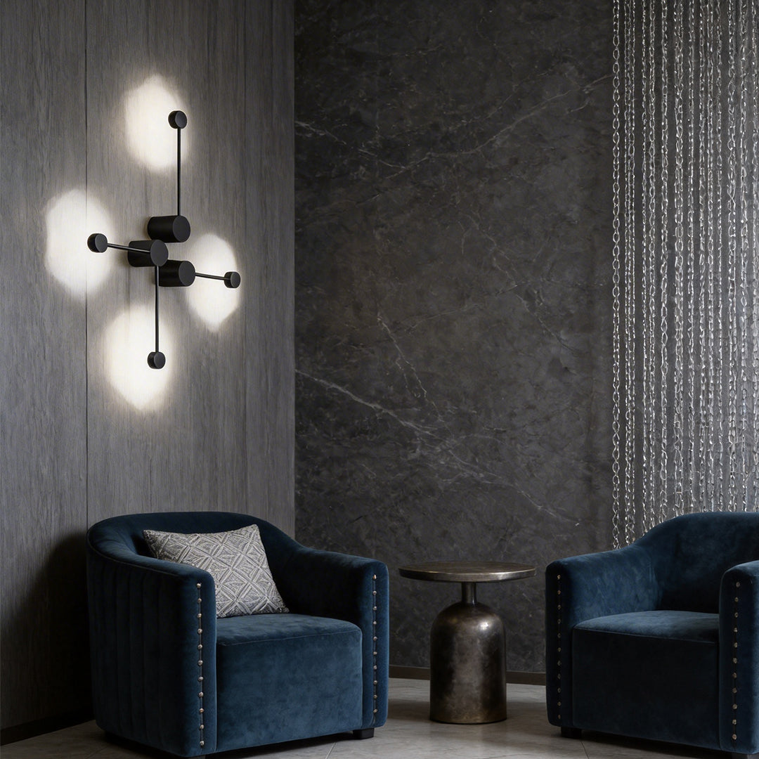 Black wall light providing soft illumination in a stylish bedroom.