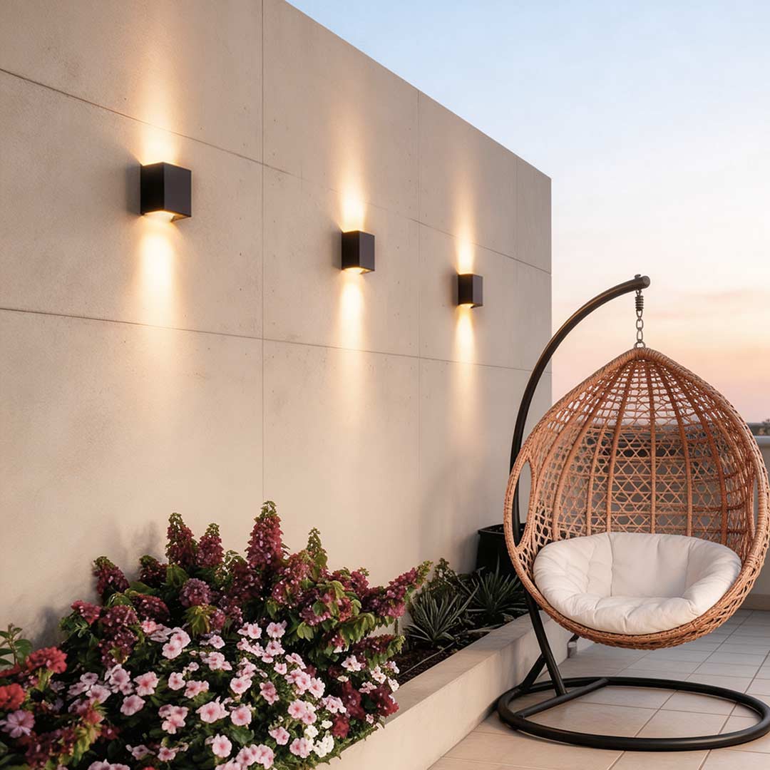 Black wall lights enhancing a contemporary exterior wall with elegant ambient light.