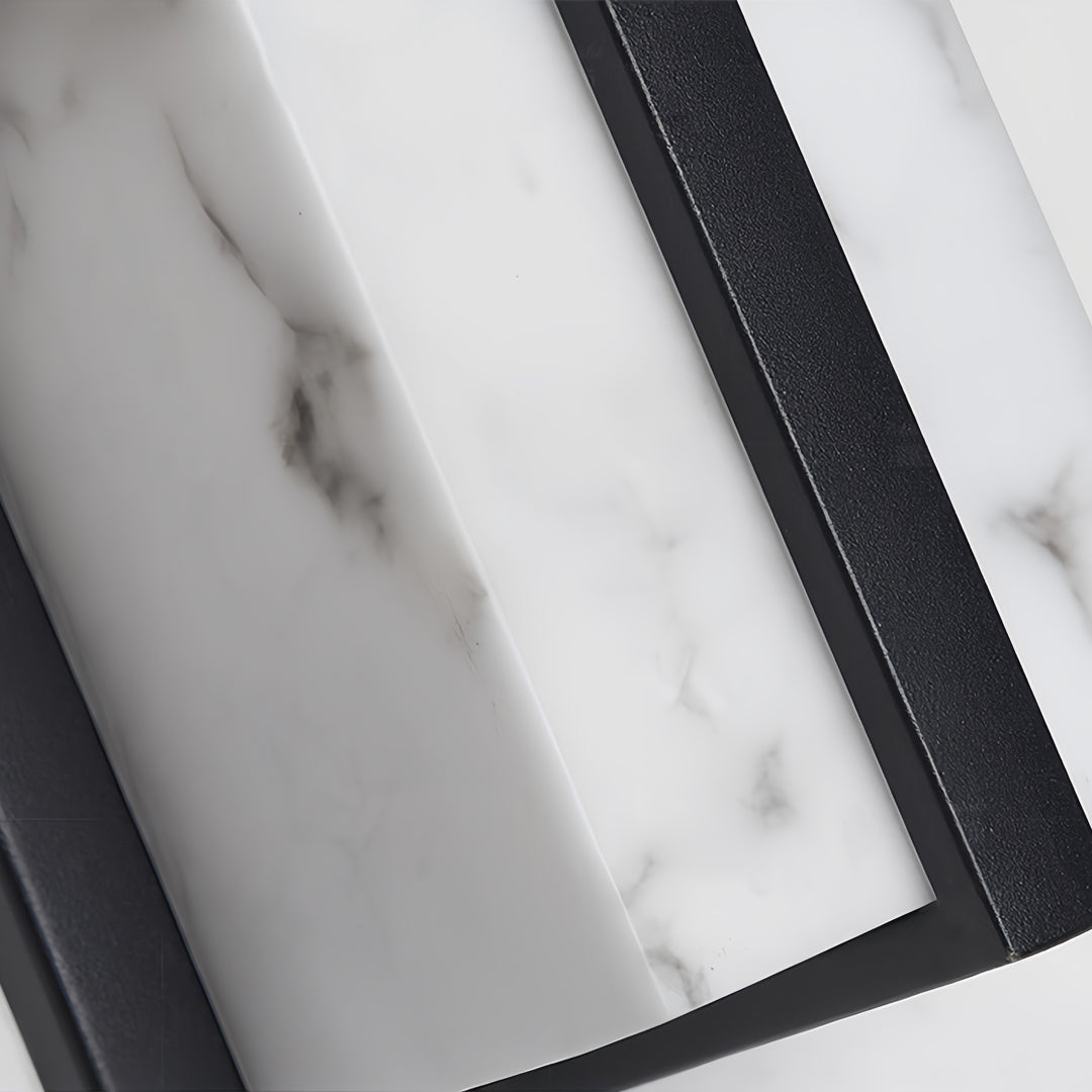 Detail view of black wall lights displaying angular metal frame construction and geometric design elements