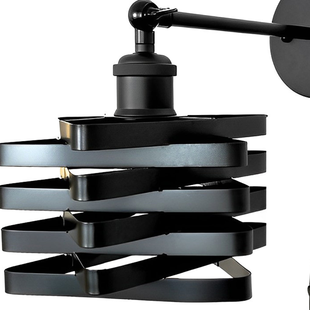Close up of wall mount lights with plug, highlighting the black finish and adjustable arm for flexible lighting.