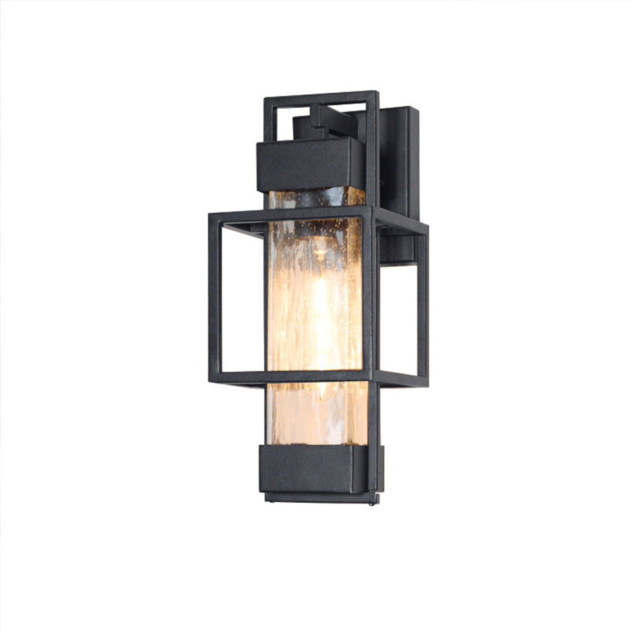 Single black wall-mounted lantern with clear glass panels on white background
