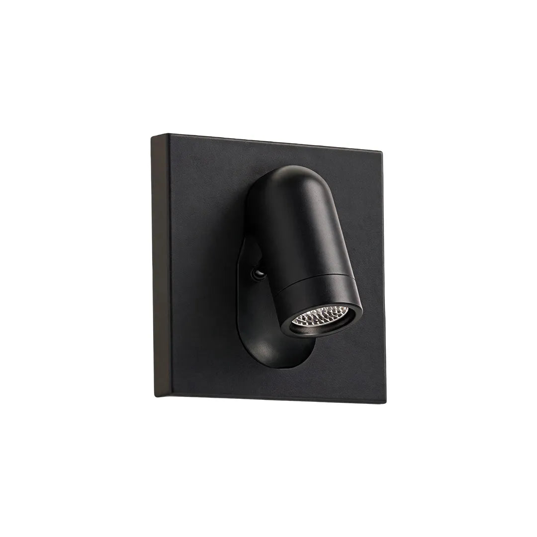 Black wall mounted LED reading light with an adjustable cylindrical head and square backplate.