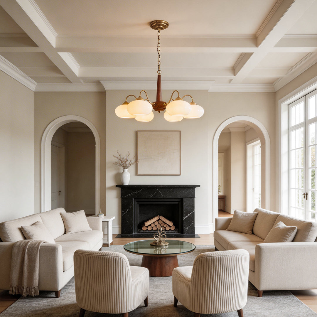 Black walnut brass chandelier enhancing a contemporary living room with elegant light.