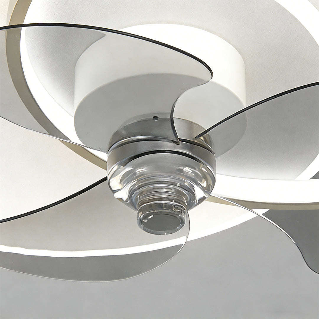 Close-up detail of blades and motor of a black and white ceiling fan with light.