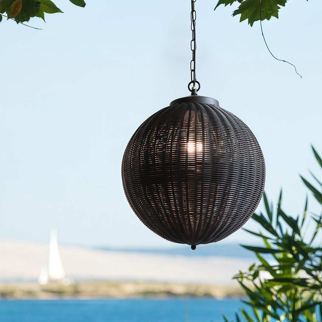 Black woven pendant lights in a bright living room, offering ambient lighting and a unique design element.