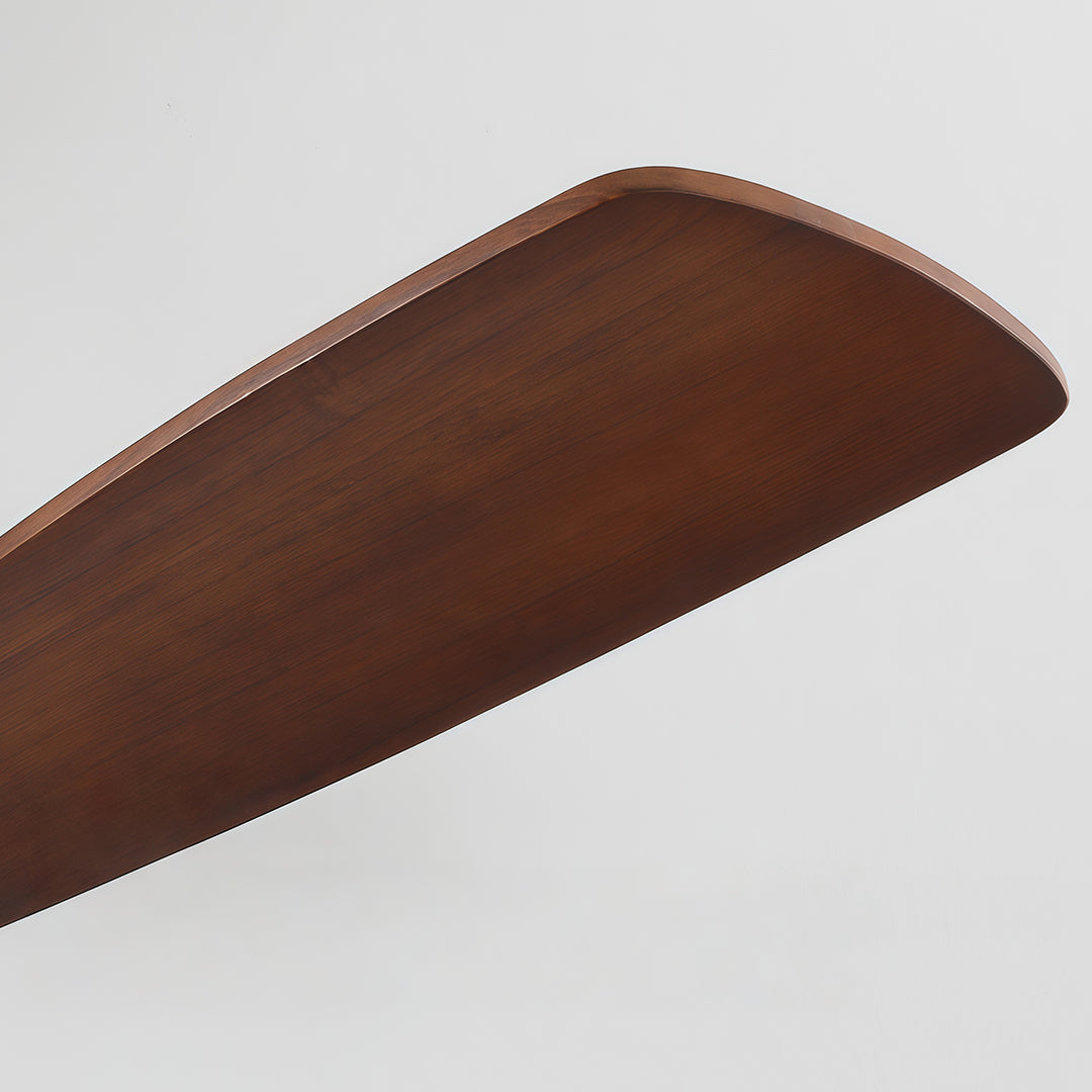 Detailed view of ceiling fan blades, showcasing the wooden texture and gold trim.