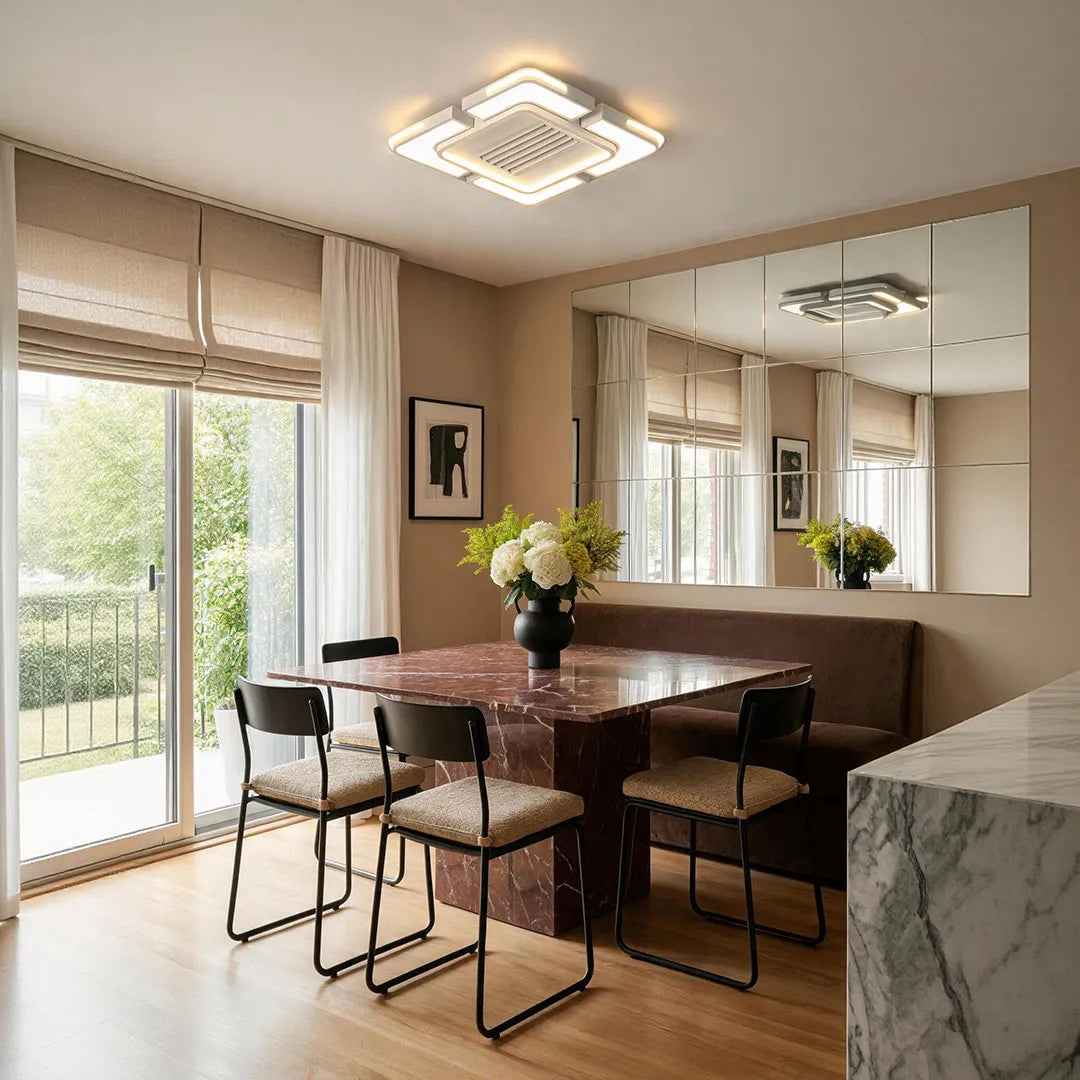 Bladeless ceiling fan with lighting installed above a dining area with a geometric square ceiling light.
