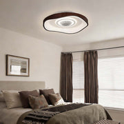 Bladeless fan with light in a modern bedroom, providing illumination and airflow.