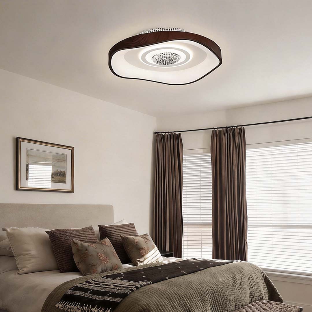 Bladeless fan with light in a modern bedroom, providing illumination and airflow.
