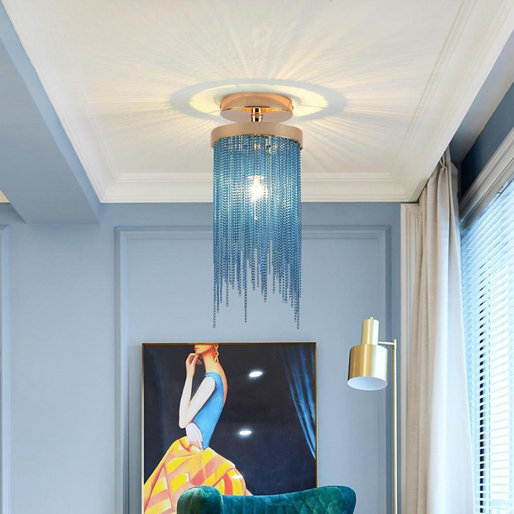 Blue tassel chandelier flush mount adding a colorful accent to a light blue room with wall art.