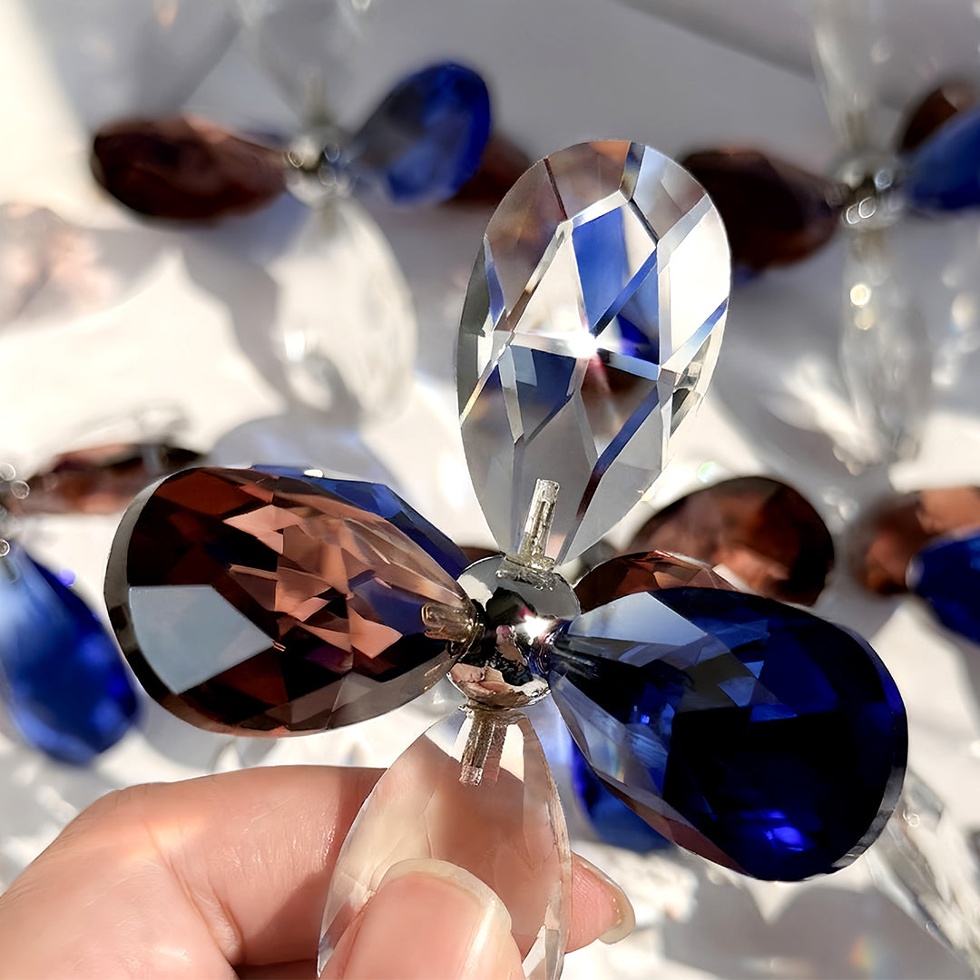 Close-up of crystal flush mount lights showing blue teardrop and clear crystal details